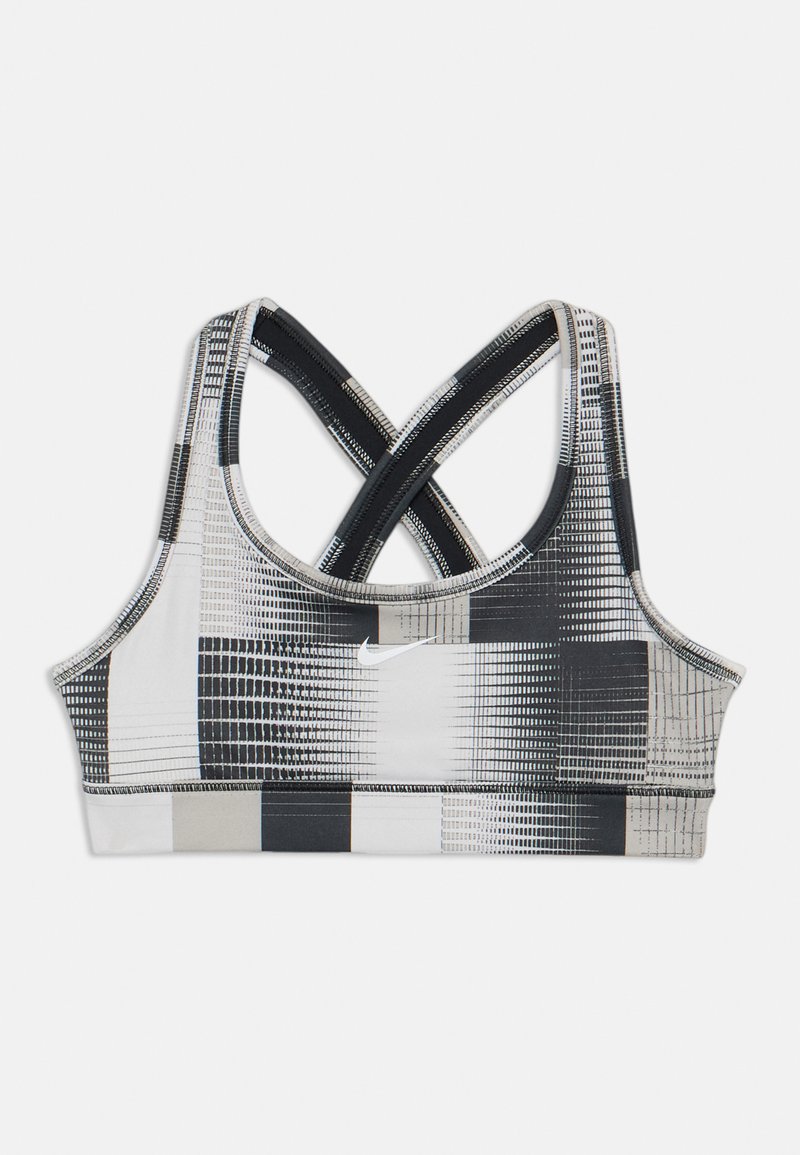 Svart og hvit sports-bh med rutemønster. Har kryssede stropper, en tettsittende design, og Nike-logo. Laget av elastisk stoff.