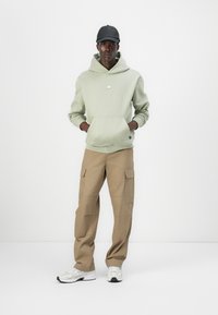 New Balance ALL DAY UNIFORM HOODIE UNISEX - Mikina - green