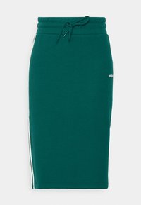 Vihreä puuvillainen midihame, jossa on joustava vyötärönauha, kiristysnauha ja valkoiset sivuraidat. Edessä pieni logo. Sileä pinta.