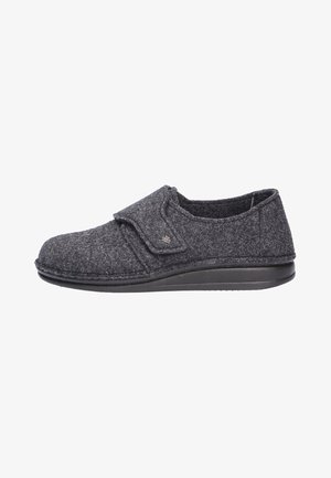 Gray felt slipper with Velcro strap closure, round toe, low black rubber sole, and textured upper featuring stitched detailing.