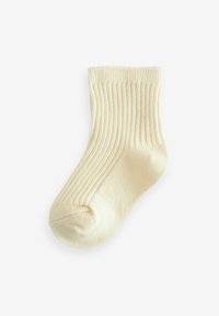 Cremfarbener Baumwollsocken mit gerippter Textur, knöchelhoch, mit nahtlosem Zehenbereich und flexiblem Bündchen für zusätzlichen Komfort.