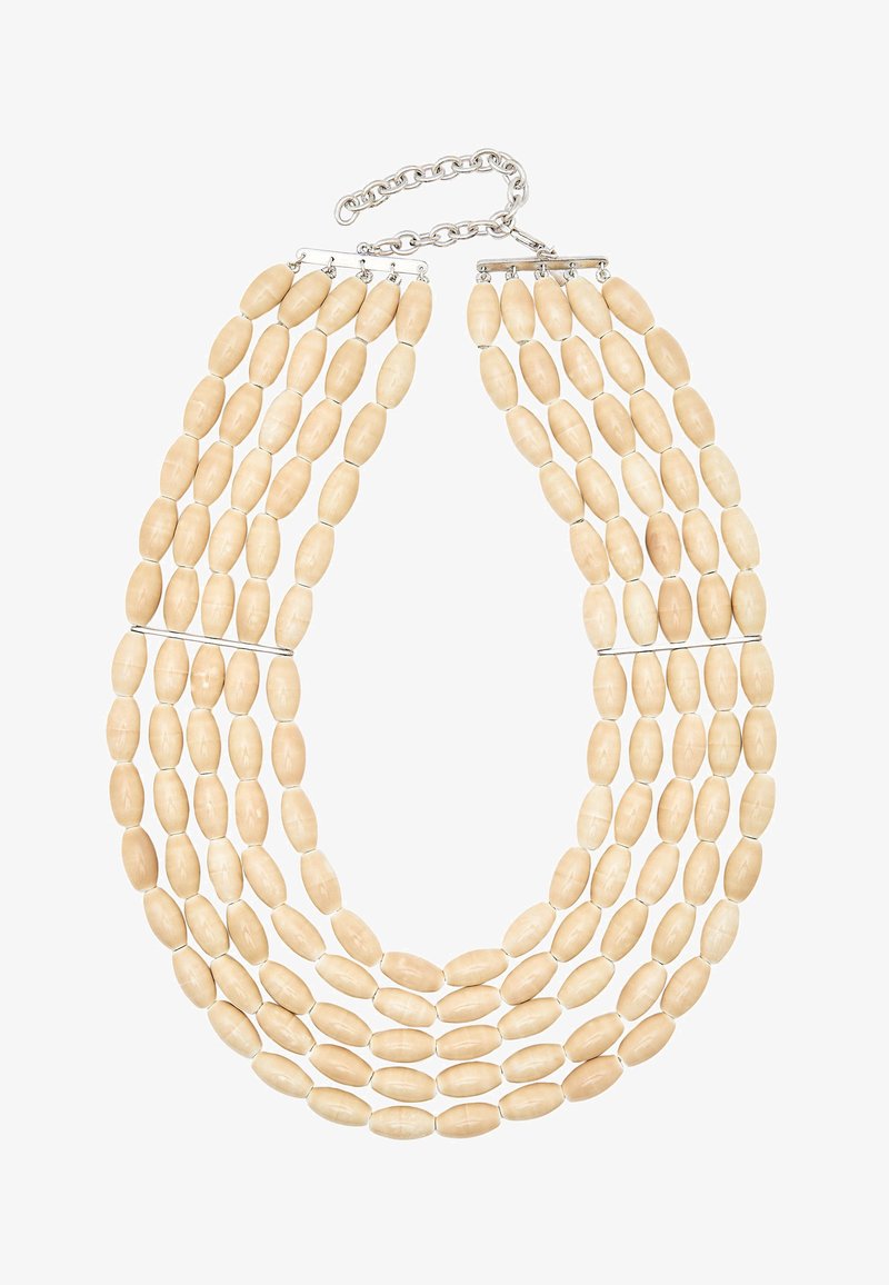 Collier multi-brins composé de perles allongées beige, doté d'un fermoir chaîne et connecteur en argent, avec une texture lisse et une forme uniforme.