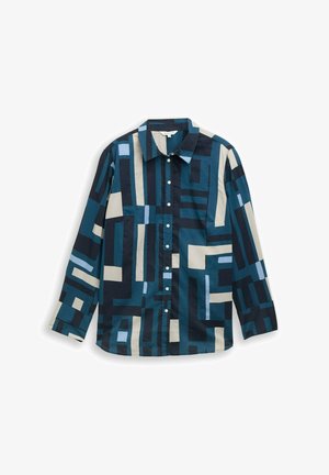 Dolga majica v temno modri barvi z abstraktnimi geometrijskimi vzorci v svetlo modri, smetanasti in črni barvi. Ima klasičen ovratnik in gumbno zapiranje.