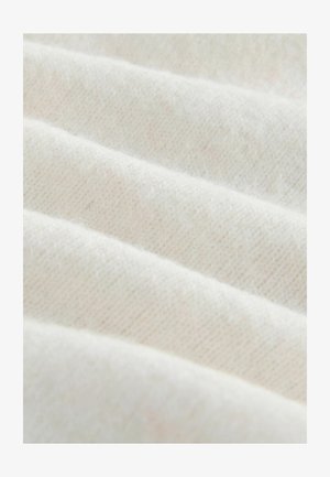 Cream-colored, textured fabric with a soft, knitted appearance, featuring subtle diagonal lines and a slight sheen.