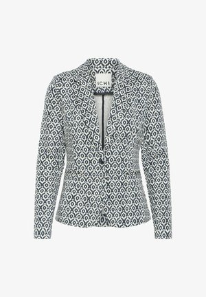 Blazer avec un motif géométrique bleu marine et blanc, coupe ajustée, revers cranté et fermeture à un bouton, fabriqué à partir d'un tissu léger.