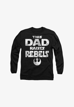 Black long-sleeve shirt featuring large white distressed text that reads "THIS DAD RAISES REBELS" with a star symbol below.