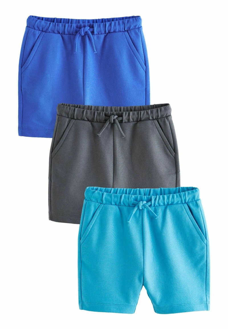Trois paires de shorts : un bleu, un gris et un teal. Chacune possède une taille avec cordon de serrage et des poches latérales, fabriquée dans un tissu doux.