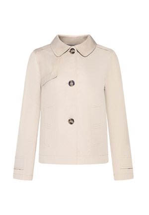 Giacca beige con scollo a collo, tre bottoni anteriori, due tasche e dettagli cuciti su spalle e maniche. Tessuto dalla trama morbida.