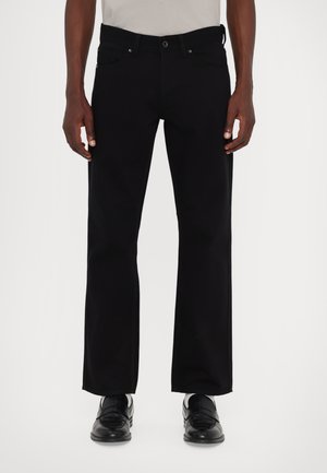 Black straight-leg jeans with a mid-rise waist, featuring a button and zipper closure, front and back pockets, and subtle stitching.