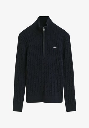 Marineblauwe gebreide trui met een gestructureerd kabelpatroon, hoge kraag en een halve rits. Bevat een klein logo op de linkerborst.