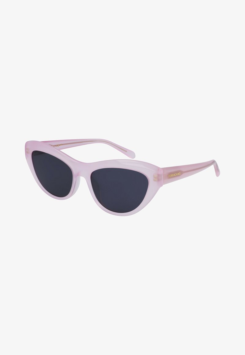Pink transparent cat-eye sunglasses with dark lenses, featuring subtle gold accents on the temple for a modern design.