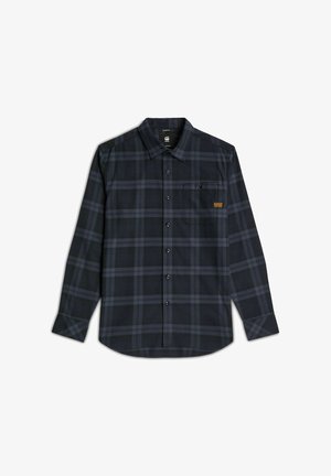 Camicia a maniche lunghe a quadri in blu navy scuro con linee grigie. Presenta una tasca sul petto e bottoni neri. Realizzata in tessuto tessuto con una consistenza liscia.