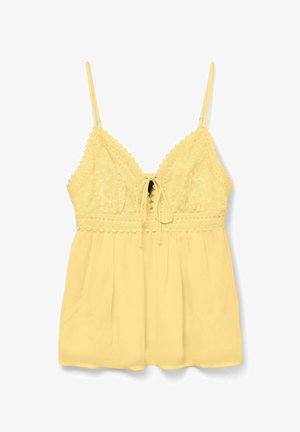 Camisole jaune sans manches avec corsage en dentelle, détail noué à l'avant, et tissu fluide en dessous de la taille.