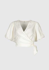 Blouse blanche à enrouler avec décolleté en V profond, manches courtes bouffantes et détail de nœud sur le côté à la taille sur fond uni.