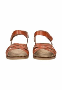 Braune Ledersandalen mit gekreuztem Riemendesign, verstellbarem Knöchelriemen, offenen Zehen und flacher Sohle mit strukturiertem Fußbett.
