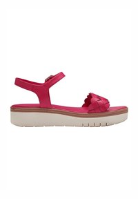 Sandale rouge à bout ouvert avec bride à la cheville, détails festonnés à l’avant et semelle épaisse beige avec un léger motif de semelle.