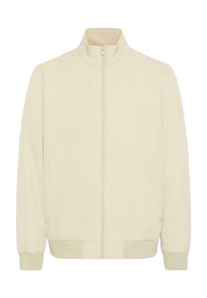 Beige jas met ritssluiting, geribbelde boorden bij de manchetten en zoom, twee zijzakken en een hoge kraag, plat liggend afgebeeld op een witte achtergrond.