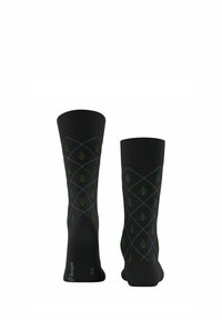 Calzini neri in cotone con un motivo a diamante caratterizzato da alberi verdi e dettagli rossi. Le estremità a coste offrono una finitura texture.