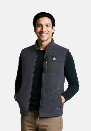 Gray fleece vest with a high collar, zip front, and a chest pocket. Features a textured finish and a black logo on the pocket.