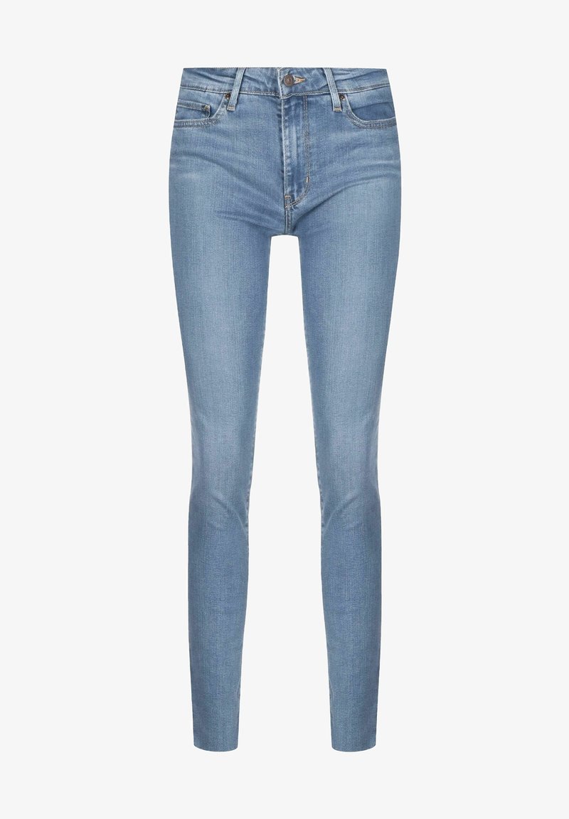 Jean skinny bleu clair avec poches avant, passants pour ceinture et fermeture par bouton, présenté sur fond blanc.