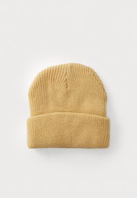 Béret tricoté en jaune clair avec un revers, présentant un motif de point texturé et un sommet arrondi. Composition en matériau doux.