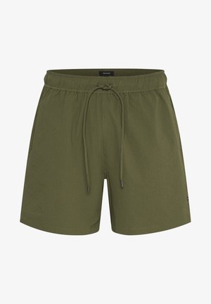 Maslinaste zelene kratke hlače od teksturirane tkanine, s elastičnim pojasom koji se može podešavati uzicom, te bočnim džepovima za praktičnost.