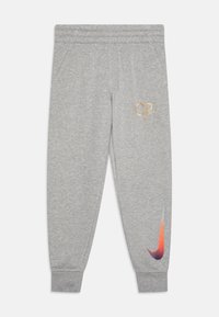 Gray cotton jogger pants with a ribbed waistband and cuffs. Features a gold "CR7" logo and a multicolored Nike swoosh on the leg.