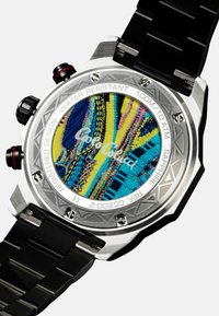Chronograph watch with a stainless steel case, black band, and a colorful patterned dial featuring blue, yellow, and pink hues. Water resistant to 100m.