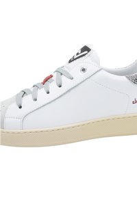 White leather sneaker with grey laces, textured grey accents, and red detail. Features a cushioned sole and perforated panel at the heel.