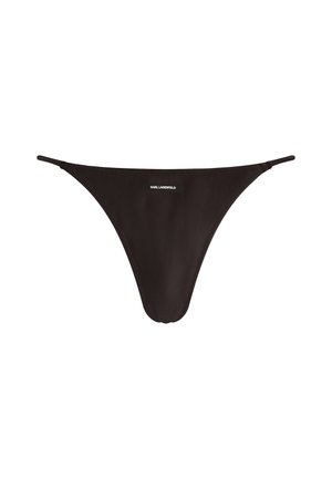 Perizoma nero realizzato in materiale liscio. Presenta cinturini sottili e un piccolo etichetta con il marchio sulla parte anteriore. Design minimalista.