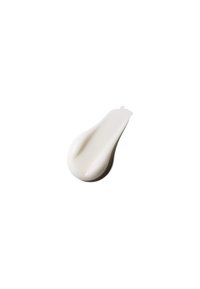 Substance crémeuse blanche avec une texture lisse, en forme de goutte, présentant de légères rainures et un bord arrondi.