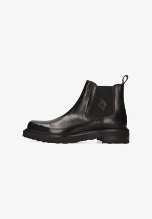 Bota Chelsea de cuero negro con paneles elásticos laterales, punta redondeada y suela de goma negra texturizada. Cuenta con una lengüeta para facilitar su colocación.