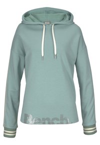 Hoody in licht turquoise katoen, met witte trekkoorden, zilveren tekst "Bench" aan de onderkant en gestreepte manchetten. Zachte textuur.
