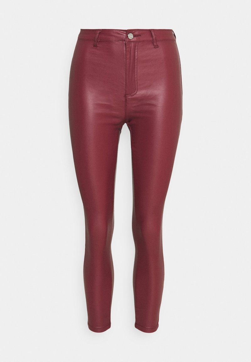 Burgundy faux leather leggings with a high waist, slim fit, and front seam detail. Smooth texture with a shiny finish and no visible hardware.