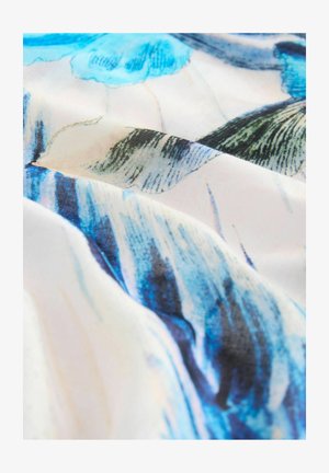 Fabric with blue and white floral pattern, smooth texture, featuring flowing lines and soft color transitions on a light background.