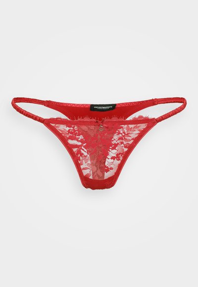 Red lace thong featuring a floral pattern, satin waistband, and minimal coverage with thin straps. Includes a small metallic accent.