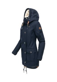 Navy blue parka jacket with a soft, lined hood, snap buttons, front pockets, and drawstring hem. Features textured fabric and wooden accents.