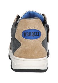 Gray and tan suede sneaker with a blue fabric interior, featuring a white sole and a black accent. "BRAQEEZ" logo on the heel tab.