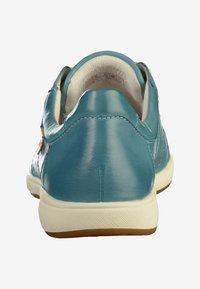 Turquoise leather sneaker with a smooth texture, white rubber sole, and minimal stitching detail. Clean design with no visible branding.