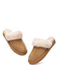 Tan suede slippers with a fluffy beige faux fur cuff, rounded toe, solid rubber sole, and visible stitching details.