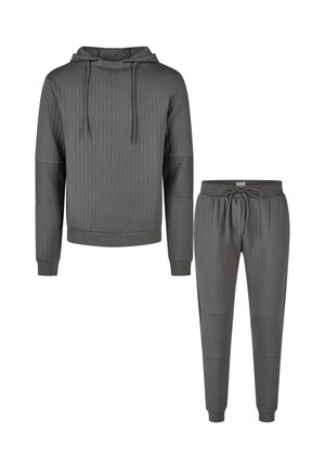 Ensemble composé d'un sweat à capuche côtelé gris foncé avec un cordon de serrage assorti et d'un pantalon de jogging. Il comprend des détails de patchs aux coudes et aux genoux, des poignets côtelés et une taille côtelée.