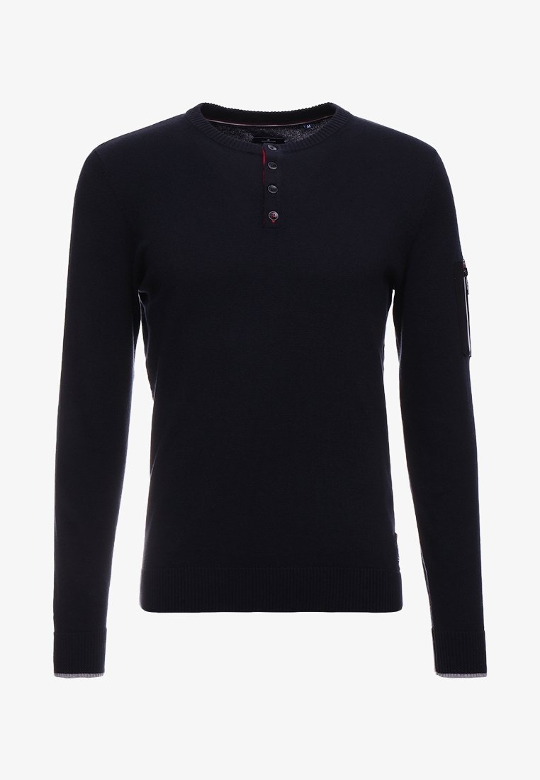 Pull henley noir à manches longues avec col rond côtelé, patte à trois boutons, poignets et ourlet côtelés, et poche zippée sur la manche gauche.