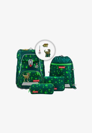 Green backpack set featuring a dinosaur design, with a textured finish and scattered patterns. Includes various accessories: pouches and a drawstring bag.