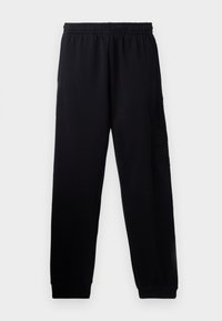 Black sweatpants with an elastic waistband, tapered legs, and a textured logo detail on the left leg. Made from soft, lightweight fabric.