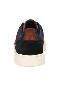 Sneaker with a navy textile upper, brown leather accents, and a cushioned white sole. Features a padded collar and textured back panel.