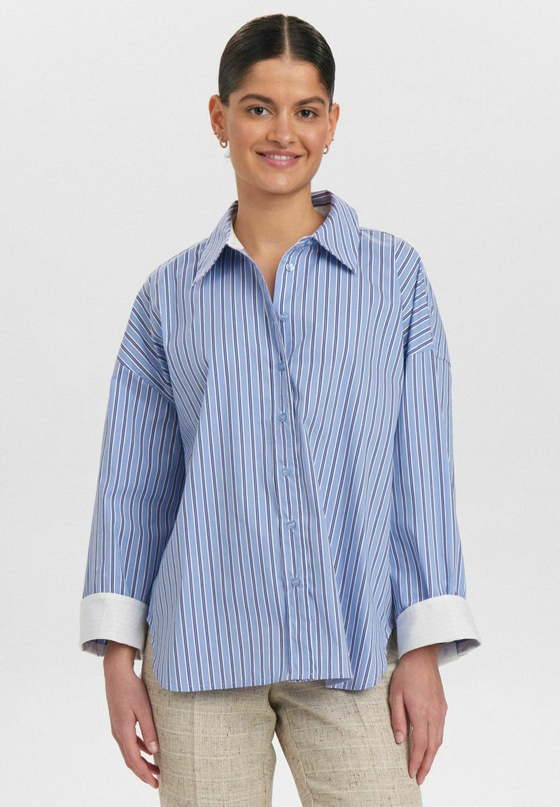 Blue and white striped shirt with a large collar, button-up front, and rolled-up cuffs. Soft fabric with a relaxed fit design.