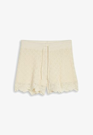 Shorts en maille couleur crème avec taille à cordon et ourlet festonné, présentant un délicat motif de dentelle géométrique.