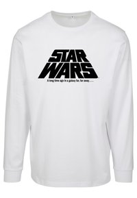 Hvid langærmet T-shirt med et stort sort "STAR WARS" logo og teksten: "For længe siden i en galakse langt, langt væk..."