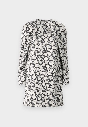 Cvetlična obleka s belimi cvetovi na črnem ozadju. Dolgi rokavi, visok ovratnik in nabran detajl na ramenih. Obleka srednje dolžine.