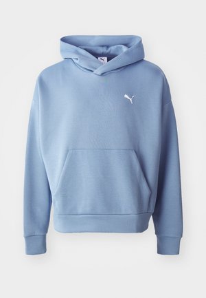 Light blue hoodie made of soft material, featuring a front pocket, ribbed cuffs, and a small white logo on the upper left chest.
